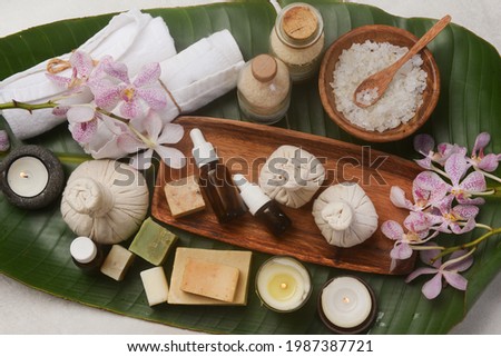 Spa bath set with healthy objects on big leaf 

