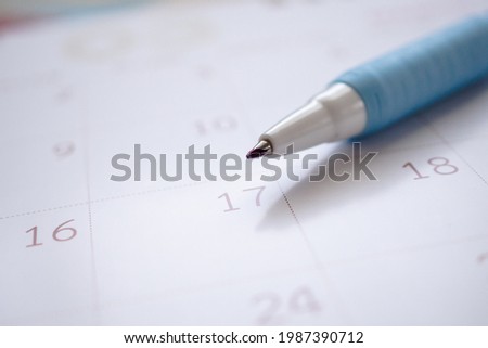 calendar page with pen close up background business planning appointment meeting concept
