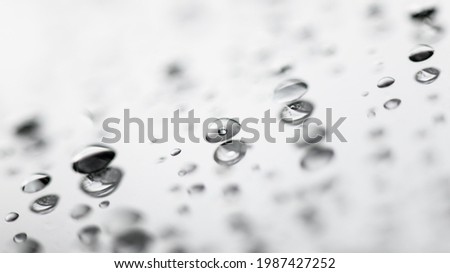 Blurred background with water drops on glass. Macro closeup