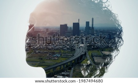 Silhouette of woman and modern cityscape. Double exposure.