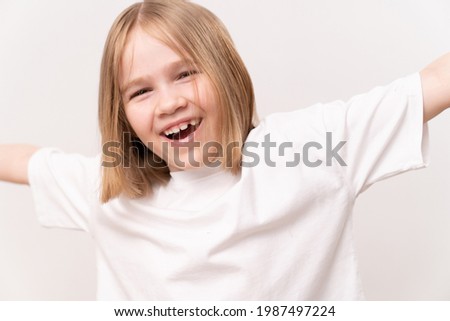 cheerful and happy little girl with a haircut quad on a white background. happy childhood. vitamins and medicine for the child.