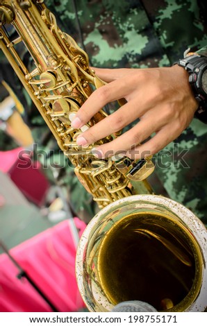 fingers playing a saxophone, Close up shot