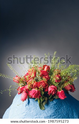 bouquet of dried pink roses, dark background
