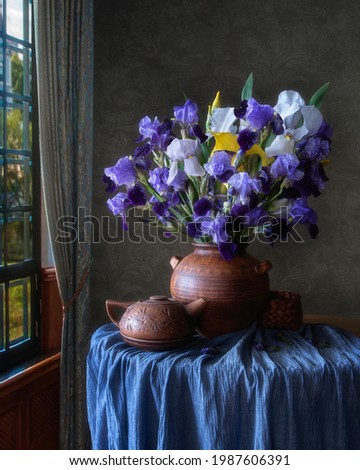 Still life with bouquet of iris flowers