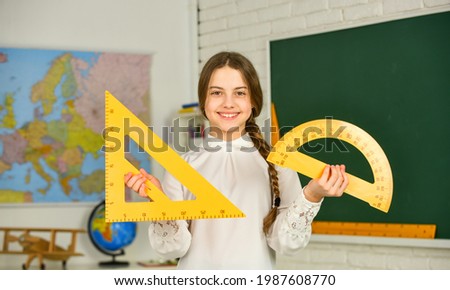 Share quality educational content. STEM concept. Draw geometric figures. Cute girl with rulers. Favorite school subject. Education and school concept. Student learning geometry. Kid school uniform