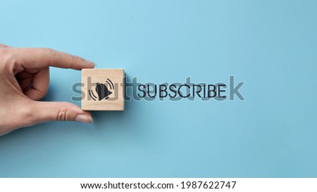 A wooden cube with drawings of a bell and the inscription: "subscription". The symbol for subscribing to an online newsletter
 Royalty-Free Stock Photo #1987622747