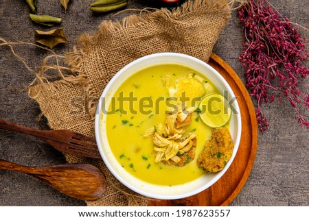 Nasi Soto Ayam or Soto Medan is  Traditional chicken soup with rice from Medan, North Sumatra. 

Soto is a traditional Indonesian soup mainly composed of broth, meat, fried patties and vegetables. Royalty-Free Stock Photo #1987623557