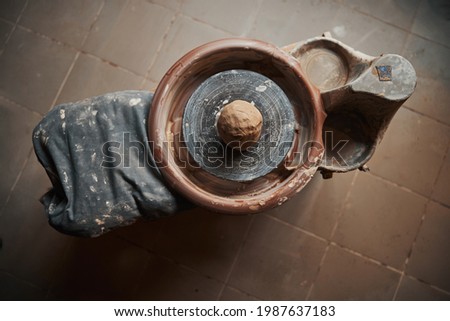 Image of working delicate process of manufacturing clay product in pottery studio