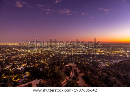 View over Los Angeles while night falls over the city of angels