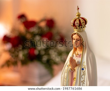 Our Lady of Fátima, is a Catholic title of the Blessed Virgin Mary based on the Marian apparitions reported in 1917 by three shepherd children at the Cova da Iria, in Fátima, Portugal. Royalty-Free Stock Photo #1987761686