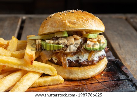 hamburger with sautéed mushrooms and avocado