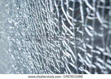 Transparent background of cracks on broken glass, texture