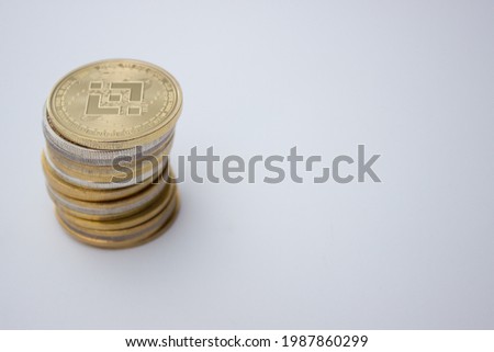 Stack of binance coins over white background