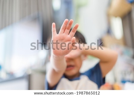 Tantrum and Angry boy at home.Depressed toddler complaining.Attention deficit hyperactivity disorder (ADHD) Concept.kid child raised. Crying for attention Royalty-Free Stock Photo #1987865012