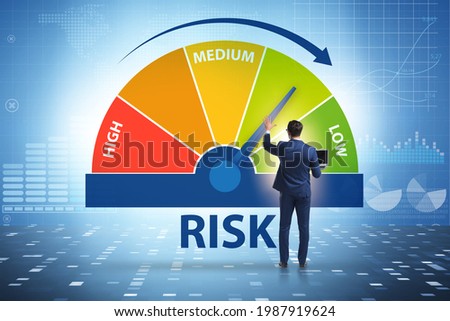 Businessman in risk metering and management concept Royalty-Free Stock Photo #1987919624