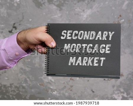 Financial concept about SECONDARY MORTGAGE MARKET with sign on the sheet. 
