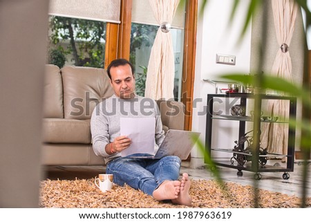 Man using laptop and documents while planning budget finance. Royalty-Free Stock Photo #1987963619