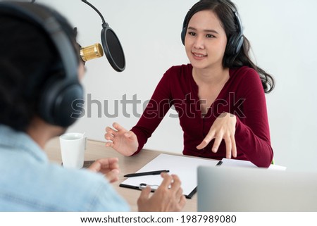 Radio Asia Podcast host hosts and recordings in a studio. Male and female speakers chatting merrily with the audience at home.