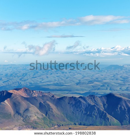 alpine landscape with clouds and mountain ranges. natural mountain background