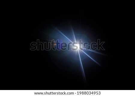 Easy to add lens flare effects for overlay designs or screen blending mode to make high-quality images. Abstract sun burst, digital flare, iridescent glare over black background. Royalty-Free Stock Photo #1988034953