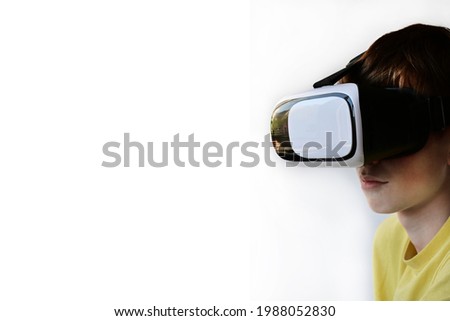 Portrait of a young man wearing virtual reality glasses. The concept of technology, science, innovation, and cyberspace. Copy space