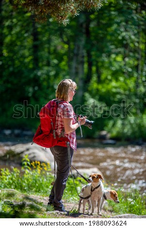 Woman takes photos at river