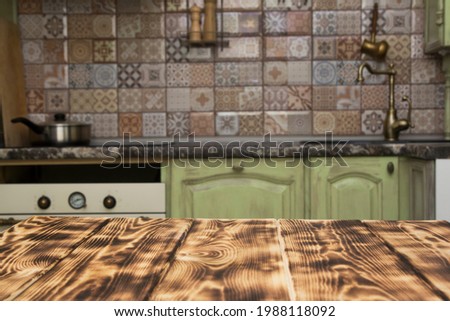 wooden table on blurred kitchen background