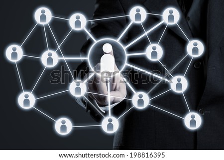 Businessman navigating social network connections on futuristic touch screen display