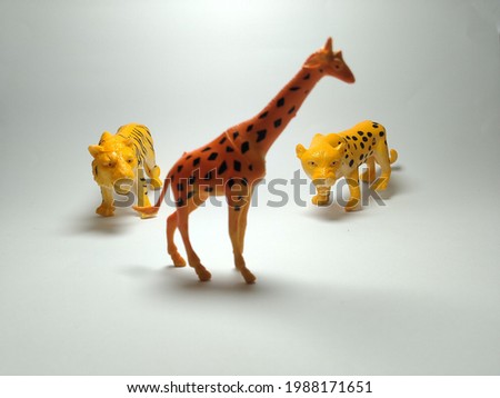 Giraffe, Tiger and Cheetah Plastic Toy - Miniature Plastic Toy Animals on white background