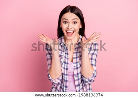 Photo portrait of girl in casual clothes smiling amazed shocked isolated on pastel pink color background
