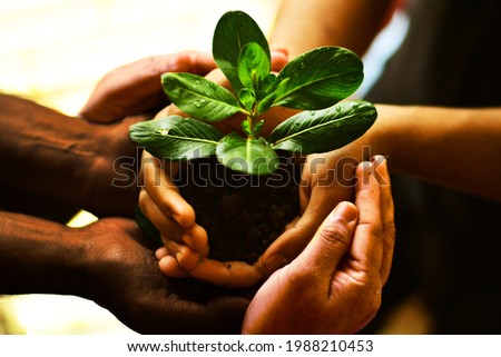 Billions of people but one planet, lets hold hands together... Royalty-Free Stock Photo #1988210453