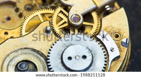 Gears of a vintage metal business clock watch clockwork, time mechanism banner