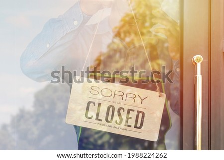 Sorry we are closed sign hanging outside a restaurant, store, office or other,Covid-19