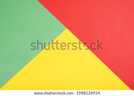 vibrant color paper background in red green and yellow
