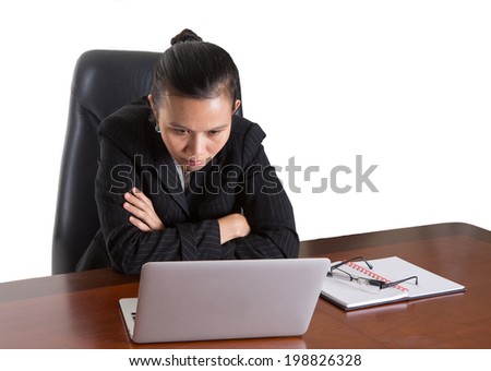 Asian Malay woman at her office desk over white background