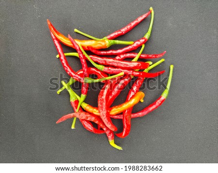 red chilli in a black background