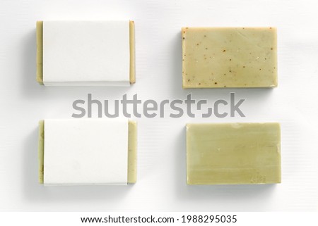 Soap wrap box mock-up package with bar olive soap on white background Royalty-Free Stock Photo #1988295035