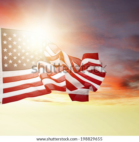 American flag flying in bright sky