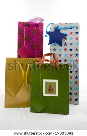 Several colourful gift bags isolated on white