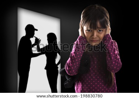 Crying illtle asian girl with her fighting parents in the background Royalty-Free Stock Photo #198830780