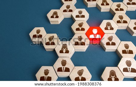 Red man in the general structure of people's connections. A key essential employee. Irreplaceable valuable employee. Specialist and professional. Experience, communication leadership skills. Royalty-Free Stock Photo #1988308376