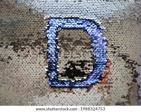 English alphabet, drawing from sequins, letter d
