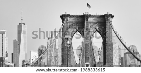 Black and white picture of Brooklyn Bridge and Manhattan skyline, New York City, USA.