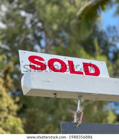 Real estate sold sign displayed on a recently sold residential home