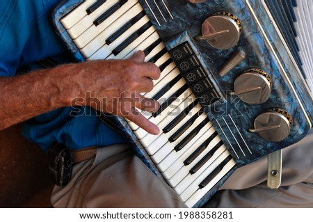 Musical instrument, accordion. Horizontal. Seen up close. Royalty-Free Stock Photo #1988358281