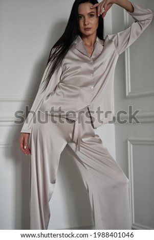 Beautiful caucasian woman in silk nightwear Royalty-Free Stock Photo #1988401046