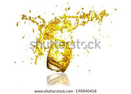 yellow splash water out of a glass isolated on white background