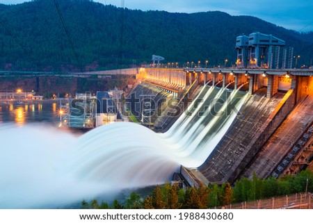view of the hydroelectric dam, water discharge through locks, long exposure shooting Royalty-Free Stock Photo #1988430680