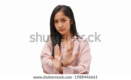 Half-length portrait of young female gesturing rejection sign isolated in white background 