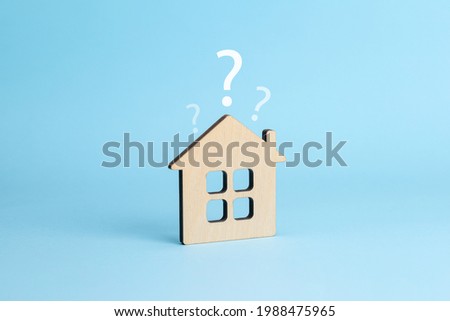 House and question mark. House selection concept. Blue background.